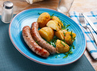 Eastern european cuisine - sausages with potatoes and onion