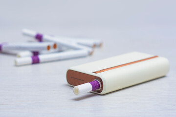 Electronic tobacco heating system with stylish design. Modern electronic device for heating tobacco sticks.