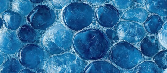 Abstract blue pebble texture with foam.