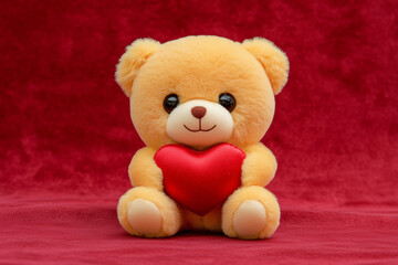 Obraz premium Teddy bear holding a red heart for Valentine's Day