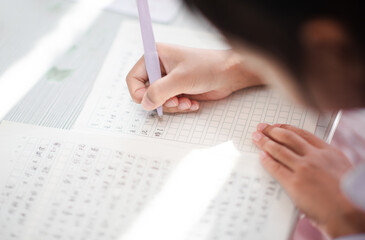 Write homework hand close-up
