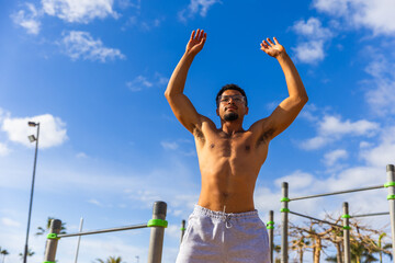 A man is warming up during his workout outroors