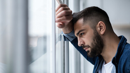 Depressed caucasian man losing job and heartbroken at same time alone, feeling bad and expresses...