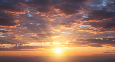 Fototapeta premium An enchanting summer evening sky is illuminated by dazzling golden and amber tones.