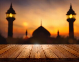 empty wooden table for product display, illuminated by soft, warm light. A blurry glowing Ramadan lantern and a hint of a mosque silhouette are blurred in the background for depth