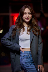 Trendy and Stylish Young Woman Posing Gracefully in an Urban City Setting Full of Life