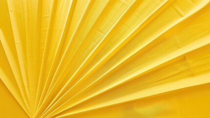 A vibrant yellow fabric arranged in pleats, showcasing texture and color.