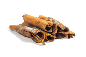 Cinnamon stick isolated on white background. Cinnamon bark is a spice obtained from the inner bark of several species of trees of the genus Cinnamomum that is used for sweet and savory dishes.