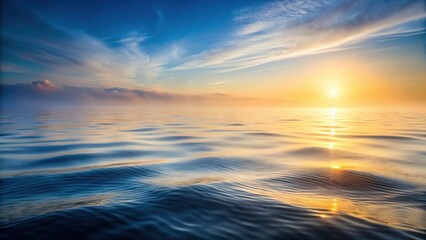Obraz premium Gentle morning light dances across a serene sea as ripples disturb the surface, revealing a misty veil of fog , calm, waves, calm