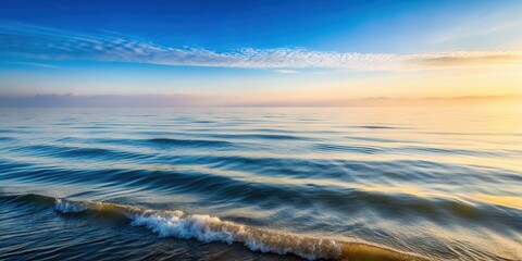 Obraz premium Gentle Morning Waves Ripples on Calm Sea Water , fog, morning