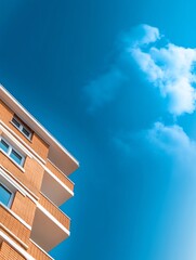 Modern apartment building rises sharply against vibrant blue sky. AI Generated