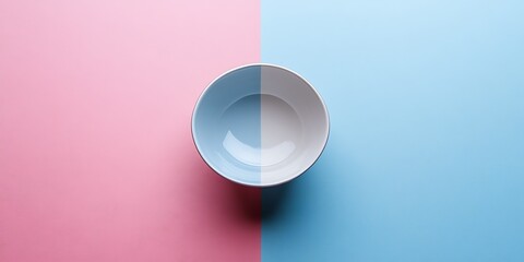Empty bowl on pink and blue background, food preparation concept