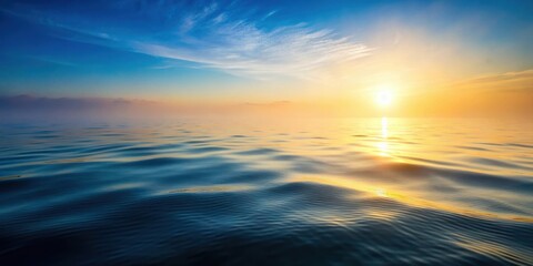Obraz premium Softly glowing sea surface with gentle ripples and misty morning fog rising from the ocean , ocean, fog
