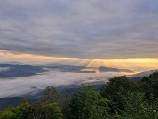 Witness a breathtaking sunrise and sea of mist at Doi Samer Dao, a must-visit destination in Nan Province, Thailand.