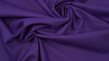 Close-up of dark purple cotton fabric showcasing a rich, deep hue with a detailed woven texture, soft natural fibers, and a smooth surface ideal for design or background use.