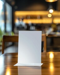 Blank menu stand placed on a wooden table in a cozy cafe, perfect for customization or advertisement mockup.