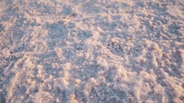 Close up shot of white sand of White Rann of Kutch in Gujarat, India. Salt crystal deposition on salt flats after evaporation of water.