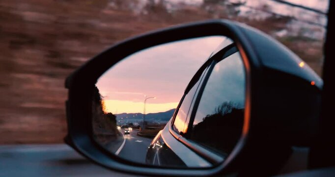 sunrise sky and moving in the  car side mirror