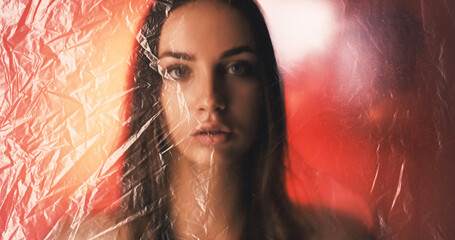 Woman protection. Defocused portrait. Social isolation. Tired lady looking through wrinkled texture...