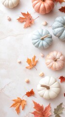 A serene autumn arrangement featuring decorative pumpkins and colorful leaves on a marble surface.