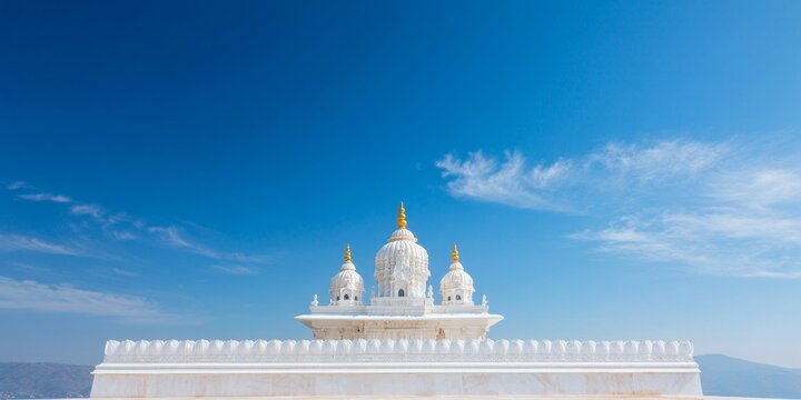 Temple View Temple Wide-Angle View of a Majestic White Indian Temple with Golden Decorations Against a Clear Blue Sky, Emphasizing Serenity and Spirituality