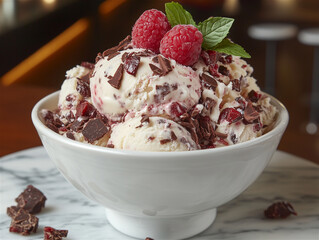 Food photo: delicious ice cream with raspberries in a bowl.