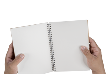 Hand holding a blank white hard cover book, cut out. Close up of two hands holding a blank paper.