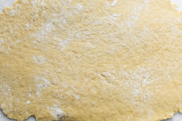 Nigerian Chin chin dough on a white granite countertop, Raw chin-chin on a chopping board, process of making chin chin achomo or klenat