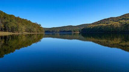 Obraz premium Calm Lake Surrounded by Mountains 