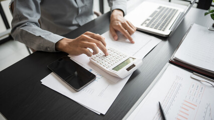 Business man accountant financial analyst and auditor working and laptop for calculating 