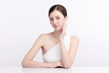 Fototapeta premium Beautiful young woman with clean fresh skin on white background, Face care, Facial treatment, Cosmetology, beauty and spa, women portrait.
