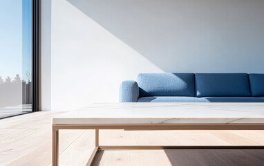 Modern living room interior with minimalist design featuring a blue sofa and natural light