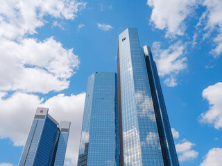 Fototapeta premium Bottom view of modern skyscrapers in business district in day light