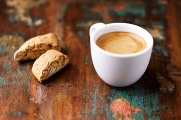 Cup of coffee and Cantuccini (Italian cookies) on dark wooden background. Copy space.	
