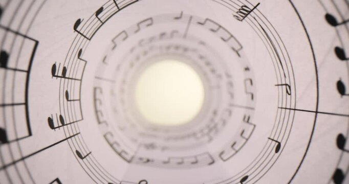 Document with musical notes, rolled up closeup