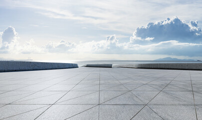 Empty square floor and coastline with white sky clouds background
