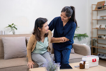 Supportive caregiver assisting elderly client with a warm smile during a home care visit