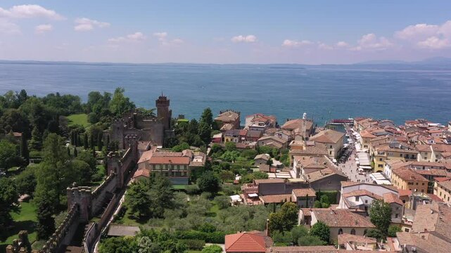 Vertical aerial view of the city center of Lazise, Lake Garda. Drone top-down flight over the historical part of Lazise, Italy.