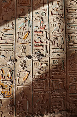 Sunrays illuminate the wall in the tomb in the valley of the Kings, Luxor, Egypt. Ancient Egyptian...