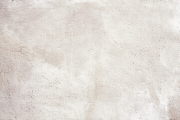 Grunge background with texture of stucco. Horizontal banner with old stucco wall texture of beige...