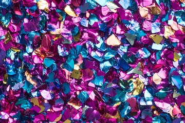 Colorful Metallic Confetti Pieces Scattered Together