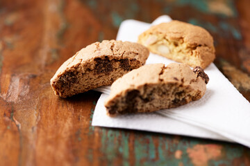 Cantuccini (Italian cookies) on dark wooden background. Close up