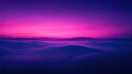 Obraz premium Blurred abstract background concept. A serene landscape showcasing a vibrant purple and pink sunset over rolling hills.