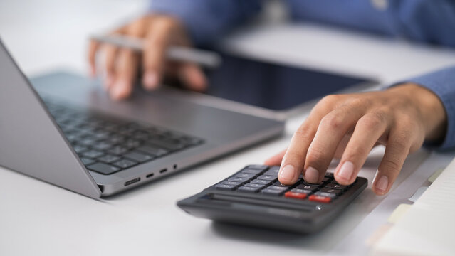 Word Tax 2025 on the calculator. .Tax deduction planning.Financial research, government taxes, and calculation tax return.