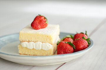 Japanese shortcake with strawberries on top is placed on a white wooden floor