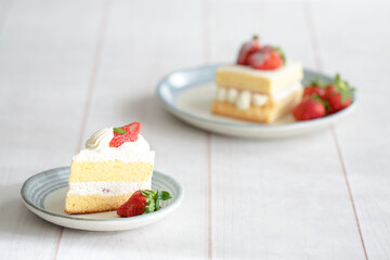 Japanese shortcake with strawberries on top is placed on a white wooden floor