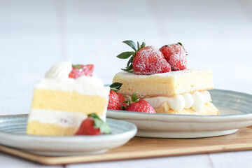 Japanese shortcake with strawberries on top is placed on a white wooden floor