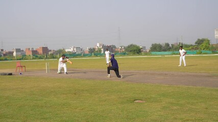 Cricket Batsman Persistently practice their hitting skills to improve their overall proficiency in the sport game, during cricket game