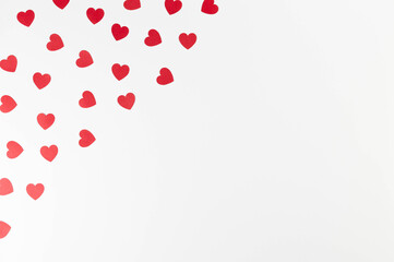 Top view of red hearts on white background. Valentine's day, red hearts, love wallpaper. Flat lay, copy space.