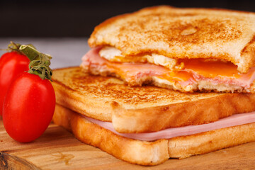 Fresh Cherry Tomatoes and Sandwiches on a Stylish Concrete Table with a Red Napkin